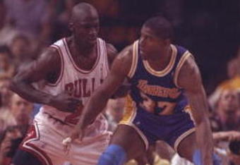 2 May 1991:  Guard Michael Jordan of the Chicago Bulls (left) and guard Magic Johnson of the Los Angeles Lakers fight for the ball during Game One of the NBA finals at the United Center in Chicago, Illinois.  The Lakers won the game, 93-91. Mandatory Cred