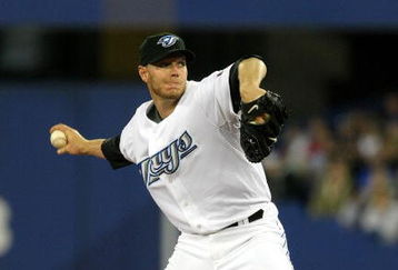 TORONTO - APRIL 6:  Roy Halladay #32 of the Toronto Blue Jays throws a pitch against the Detroit Tigers during their MLB game at the Rogers Centre April 6, 2009 in Toronto, Ontario.(Photo By Dave Sandford/Getty Images)