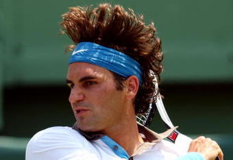 KEY BISCAYNE, FL - APRIL 03:  Roger Federer of Switzerland returns a shot against Novak Djokovic of Serbia during the men's semifinal of the Sony Ericsson Open at the Crandon Park Tennis Center on April 3, 2009 in Key Biscayne, Florida.  (Photo by Clive Brunskill/Getty Images)
