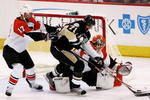 PITTSBURGH - MAY 18:  Evgeni Malkin #71 of the Pittsburgh Penguins charges goaltender Martin Biron #43 of the Philadelphia Flyers in front of Jeff Carter #17 during game five of the Eastern Conference Finals of the 2008 NHL Stanley Cup Playoffs at Mellon Arena on May 18, 2008 in Pittsburgh, Pennsylvania.  The Penguins won the game 6-0 and win the series 4-1 to advance to the Stanley Cup Finals.  (Photo by Jim McIsaac/Getty Images)