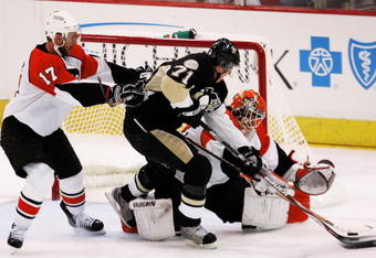 PITTSBURGH - MAY 18:  Evgeni Malkin #71 of the Pittsburgh Penguins charges goaltender Martin Biron #43 of the Philadelphia Flyers in front of Jeff Carter #17 during game five of the Eastern Conference Finals of the 2008 NHL Stanley Cup Playoffs at Mellon Arena on May 18, 2008 in Pittsburgh, Pennsylvania.  The Penguins won the game 6-0 and win the series 4-1 to advance to the Stanley Cup Finals.  (Photo by Jim McIsaac/Getty Images)