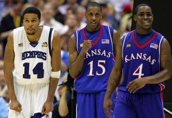 SAN ANTONIO - APRIL 07:  Mario Chalmers #15 of the Kansas Jayhawks reacts in overtime along with teammate Sherron Collins #4 as Chris Douglas-Roberts #14 of the Memphis Tigers looks on during the 2008 NCAA Men's National Championship game at the Alamodome on April 7, 2008 in San Antonio, Texas. The Jayhawks defeated the Tigers 75-68.  (Photo by Ronald Martinez/Getty Images)