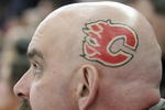 EDMONTON, AB - MARCH 3: A Calgary Flames fan sports the Flames logo on the side of his shaved head while watching the Flames take on the Edmonton Oilers in first period at Rexall Place on March 3, 2007, in Edmonton, Alberta, Canada. (Photo by Tim Smith/Getty Images)