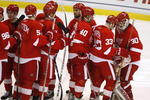 DETROIT - APRIL 26: Chris Osgood #30 of the Detroit Red Wings is congratulated by Kris Draper #33 after a 5-1 victory over the Colorado Avalanche in game two of the Western Conference Quarterfinals of the 2008 NHL Stanley Cup Playoffs on April 26, 2008 at Joe Louis Arena in Detroit, Michigan.  (Photo by Gregory Shamus/Getty Images)  
