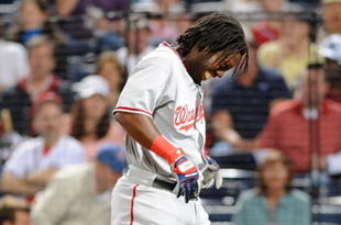 ATLANTA - APRIL 10: Outfielder Lastings Milledge #85 of Washington Nationals grimmaces after he is hit by an inside pitch against the Atlanta Braves April 10, 2009 in Atlanta, Georgia.  (Photo by Al Messerschmidt/Getty Images) 