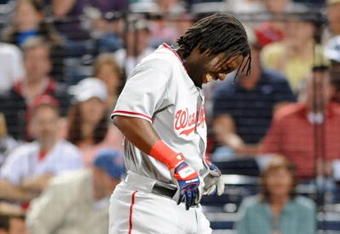 ATLANTA - APRIL 10: Outfielder Lastings Milledge #85 of Washington Nationals grimmaces after he is hit by an inside pitch against the Atlanta Braves April 10, 2009 in Atlanta, Georgia.  (Photo by Al Messerschmidt/Getty Images) 