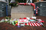 SHEFFIELD, ENGLAND - APRIL 14:  Floral tributes and Liverpool scarves lay in tribute on the Hillsborough disaster memorial at Sheffield Wednesday FC on the eve of the 20th anniversary of the Hillsborough disaster on April 14, 2009, Sheffield, England. Sheffield Wednesday FC are not holding an official service to mark the disaster but will be opening the Leppings lane end for people wishing to pay their respects. A total of 96 Liverpool supporters lost their lives during a crush at an FA Cup semi final against Nottingham Forest at the Hillsborough football ground in Sheffield, South Yorkshire on April 15, 1989.  (Photo by Christopher Furlong/Getty Images)
