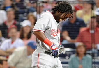 ATLANTA - APRIL 10: Outfielder Lastings Milledge #85 of Washington Nationals grimmaces after he is hit by an inside pitch against the Atlanta Braves April 10, 2009 in Atlanta, Georgia.  (Photo by Al Messerschmidt/Getty Images) 