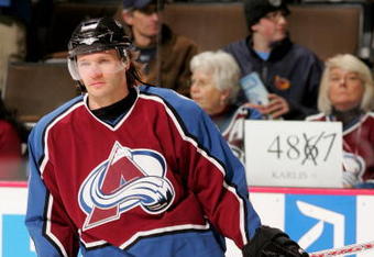 DENVER - FEBRUARY 08:  Karlis Skrastins #3 of the Colorado Avalanche warms up during pre-game skate while fans display a sign in the background as he prepares to break an NHL record as he will skate in his 487th consecutive game, the most by a defenseman, as the Avalanche host the Atlanta Thrashers on February 8, 2007 at the Pepsi Center in Denver, Colorado.  (Photo by Doug Pensinger/Getty Images)