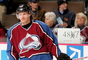 DENVER - FEBRUARY 08:  Karlis Skrastins #3 of the Colorado Avalanche warms up during pre-game skate while fans display a sign in the background as he prepares to break an NHL record as he will skate in his 487th consecutive game, the most by a defenseman, as the Avalanche host the Atlanta Thrashers on February 8, 2007 at the Pepsi Center in Denver, Colorado.  (Photo by Doug Pensinger/Getty Images)