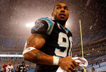 CHARLOTTE, NC - JANUARY 10:  Julius Peppers #89 of the Carolina Panthers walks off the field in the rain after being defeated by the Arizona Cardinals 33-13 in the NFC Divisional Playoff Game on January 10, 2009 at Bank of America Stadium in Charlotte, North Carolina.  (Photo by Streeter Lecka/Getty Images)
