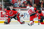 NEWARK, NJ - APRIL 11:  Erik Cole #26 of the Carolina Hurricanes is stopped by Martin Brodeur #30 of the New Jersey Devils at the Prudential Center on April 11, 2009 in Newark, New Jersey.  (Photo by Jim McIsaac/Getty Images)