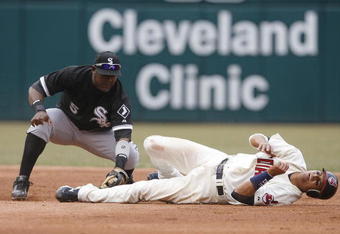 CLEVELAND - MARCH 31:  Second baseman Juan Uribe #5 of the Chicago White Sox tags Victor Martinez (R) of the Cleveland Indians out at second base during the second inning of their Opening Day game on March 31, 2008 at Progressive Field in Cleveland, Ohio.  (Photo by Matt Sullivan/Getty Images)