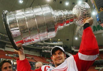 PITTSBURGH - JUNE 04: Nicklas Lidstrom #5 of the Detroit Red Wings celebrates with the Stanley Cup after defeating the Pittsburgh Penguins in game six of the 2008 NHL Stanley Cup Finals at Mellon Arena on June 4, 2008 in Pittsburgh. Pennsylvania. The Red Wings defeated the Penguins 3-2 to win the Stanley Cup Finals 4 games to 2. (Photo by Bruce Bennett/Getty Images)