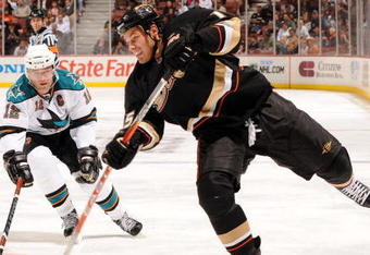 ANAHEIM, CA - OCTOBER 17:  Ryan Getzlaf #15 of the Anaheim Ducks shoots the puck in front of Patrick Marleau #12 of the San Jose Sharks during the third period at the Honda Center on October 17, 2008 in Anaheim, California.  (Photo by Harry How/Getty Images)