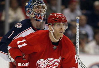 DETROIT, MI - MARCH 7:  Steve Mason #1 of the Columbus Blue Jackets is screened by Daniel Cleary #11 of the Detroit Red Wings in a game on March 7, 2009 at the Joe Louis Arena in Detroit, Michigan. The Blue Jackets defeated the Red Wings 8-2 on the strength of a hat trick by Rick Nash. (Photo by Claus Andersen/Getty Images)
