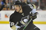 PITTSBURGH - MARCH 25:  Forward Tyler Kennedy #48 of the Pittsburgh Penguins skates with the puck against the Calgary Flames on March 25, 2009 at Mellon Arena in Pittsburgh, Pennsylvania.  (Photo by Jamie Sabau/Getty Images)
