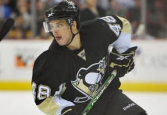 PITTSBURGH - MARCH 25:  Forward Tyler Kennedy #48 of the Pittsburgh Penguins skates with the puck against the Calgary Flames on March 25, 2009 at Mellon Arena in Pittsburgh, Pennsylvania.  (Photo by Jamie Sabau/Getty Images)