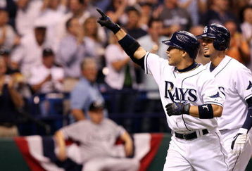 ST PETERSBURG, FL - OCTOBER 03:  Akinori Iwamura #1 of the Tampa Bay Rays celebrates with Jason Bartlett #8 after Iwamura's two run home run in the fifth inning against the Chicago White Sox in Game 2 of the American Leaugue Divisional Series at Tropicana Field on October 3, 2008 in St. Petersburg, Florida.  (Photo by Doug Benc/Getty Images)