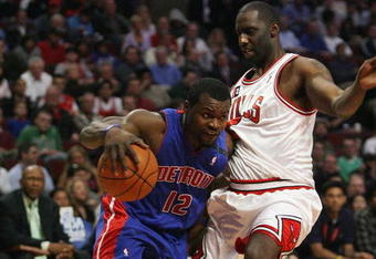 CHICAGO - MARCH 24: Will Bynum #12 of the Detroit Pistons drives around Tim Thomas #2 of the Chicago Bulls on March 24, 2009 at the United Center in Chicago, Illinois. The Bulls defeated the Pistons 99-91. NOTE TO USER: User expressly acknowledges and agreees that, by downloading and/or using this Photograph, User is consenting to the terms and conditions of the Getty Images License Agreement. (Photo by Jonathan Daniel/Getty Images)