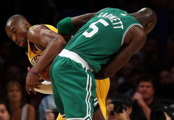 LOS ANGELES, CA - JUNE 12:  Kobe Bryant #24 of the Los Angeles Lakers and Kevin Garnett #5 of the Boston Celtics battle for the ball in Game Four of the 2008 NBA Finals on June 12, 2008 at Staples Center in Los Angeles, California. NOTE TO USER: User expressly acknowledges and agrees that, by downloading and/or using this Photograph, user is consenting to the terms and conditions of the Getty Images License Agreement.  (Photo by Lisa Blumenfeld/Getty Images)