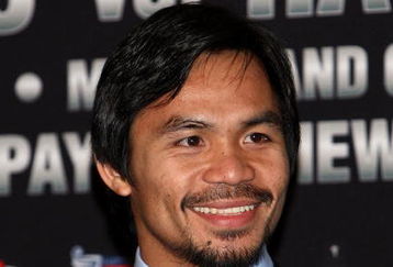 HOLLYWOOD - MARCH 30:  Professional boxer Manny Pacquiao attends 'The Battle of East and West', a promotion for the May 2, 2009 World Junior Welterweight Championship boxing match held at the Roosevelt Hotel on March 30, 2009 in Hollywood, California.  (Photo by Alberto E. Rodriguez/Getty Images)