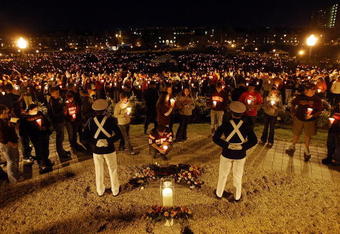 BLACKSBURG, VA - APRIL 16:  Corps of Cadets guards keep watch next to a ceremonial candle during a candlelight vigil on Virginia Tech's Day of Remembrance honoring the 32 people killed by Cho Seung-Hui April 16, 2008 in Blacksburg, Virginia.  Today is the one-year anniversary of the worst school shooting in US history.  (Photo by Mario Tama/Getty Images)