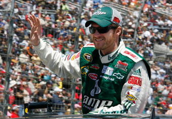 FORT WORTH, TX - APRIL 05:  Dale Earnhardt Jr., driver of the #88 National Guard/AMP Energy Chevrolet, waves to the crowd during driver intros for the NASCAR Sprint Cup Series Samsung 500 at Texas Motor Speedway on April 5, 2009 in Fort Worth, Texas.  (Photo by John Harrelson/Getty Images)