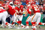 KANSAS CITY, MO - DECEMBER 14:  Tyler Thigpen #4 of the Kansas City Chiefs handsoff to Larry Johnson #27 against the San Diego Chargers during the first half on December 14, 2008 at Arrowhead Stadium in Kansas City, Missouri. The Chiefs lost 22-21.  (Photo by Harry How/Getty Images)