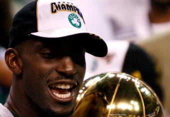 BOSTON - JUNE 17:  Kevin Garnett #5 of the Boston Celtics holds the Larry O'Brien trophy after Game Six of the 2008 NBA Finals against the Los Angeles Lakers on June 17, 2008 at TD Banknorth Garden in Boston, Massachusetts. The Celtics defeated the Lakers 131-92 to win the NBA Championship.  NOTE TO USER: User expressly acknowledges and agrees that, by downloading and/or using this Photograph, user is consenting to the terms and conditions of the Getty Images License Agreement.  (Photo by Jim Rogash/Getty Images)