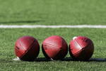 BALTIMORE - NOVEMBER 5:  Three footballs lay on the field prior to the game between the Cincinnati Bengals and the Baltimore Ravens at M&T Bank Stadium on November 5, 2006 in Baltimore, Maryland.  The Ravens defeated the Bengals 26-20. (Photo by Harry How/Getty Images)