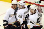 GLENDALE, AZ - APRIL 11:  (L-R) Teemu Selanne #8, Erik Christensen #26 and Andrew Ebbett #48 of the Anaheim Ducks celebrate after Christensen scored a second period power play goal against the Phoenix Coyotes during the NHL game at Jobing.com Arena on April 11, 2009 in Glendale, Arizona.  (Photo by Christian Petersen/Getty Images)