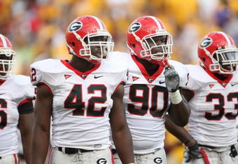 TEMPE, AZ - SEPTEMBER 20:  Defensive linemen Corvey Irvin #90 and Justin Houston #42 of the Georgia Bulldogs wait for play against the Arizona State Sun Devils on September 20, 2008 at Sun Devil Stadium in Tempe, Arizona.  Georgia won 27-10.  (Photo by Stephen Dunn/Getty Images)