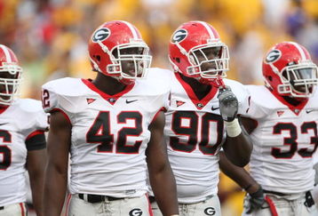 TEMPE, AZ - SEPTEMBER 20:  Defensive linemen Corvey Irvin #90 and Justin Houston #42 of the Georgia Bulldogs wait for play against the Arizona State Sun Devils on September 20, 2008 at Sun Devil Stadium in Tempe, Arizona.  Georgia won 27-10.  (Photo by Stephen Dunn/Getty Images)