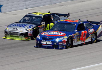 FORT WORTH, TX - APRIL 05:  Jimmie Johnson, driver of the #48 Kobalt Tools Chevrolet, races Marcos Ambrose, driver of the #47 Clorox Toyota, during the NASCAR Sprint Cup Series Samsung 500 at Texas Motor Speedway on April 5, 2009 in Fort Worth, Texas.  (Photo by John Harrelson/Getty Images)
