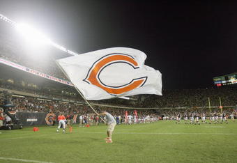 CHICAGO - AUGUST 25: A cheerleader of the Chicago Bears waves a Bears flag during the game against the San Francisco 49ers on August 25, 2007 at Soldier Field in Chicago, Illinois. (Photo by Jonathan Daniel/Getty Images)