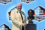 CANTON, OH - AUGUST 05:  Coach John Madden poses with his bust after his induction during the Class of 2006 Pro Football Hall of Fame Enshrinement Ceremony at Fawcett Stadium on August 5, 2006 in Canton, Ohio.  (Photo by Doug Benc/Getty Images)