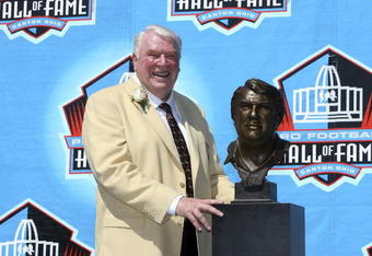 CANTON, OH - AUGUST 05:  Coach John Madden poses with his bust after his induction during the Class of 2006 Pro Football Hall of Fame Enshrinement Ceremony at Fawcett Stadium on August 5, 2006 in Canton, Ohio.  (Photo by Doug Benc/Getty Images)