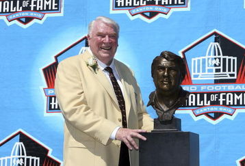CANTON, OH - AUGUST 05:  Coach John Madden poses with his bust after his induction during the Class of 2006 Pro Football Hall of Fame Enshrinement Ceremony at Fawcett Stadium on August 5, 2006 in Canton, Ohio.  (Photo by Doug Benc/Getty Images)