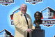 CANTON, OH - AUGUST 05:  Coach John Madden poses with his bust after his induction during the Class of 2006 Pro Football Hall of Fame Enshrinement Ceremony at Fawcett Stadium on August 5, 2006 in Canton, Ohio.  (Photo by Doug Benc/Getty Images)