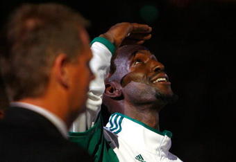BOSTON, MA - OCTOBER 28: President Danny Ainge and Kevin Garnett  #5 of the Boston Celtics watch as the 2008 World Championship banner is raised during the 2008 NBA World Championship ceremony before a game against the Cleveland Cavaliers at the TD Banknorth Garden on October 28, 2008 in Boston, Massachusetts. NOTE TO USER: User expressly acknowledges and agrees that, by downloading and/or using this Photograph, user is consenting to the terms and conditions of the Getty Images License Agreement. (Photo by Jim Rogash/Getty Images)