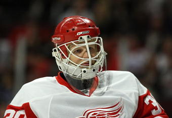 CHICAGO - APRIL 12:  Goalie Chris Osgood #30 of the Detroit Red Wings looks on against the Chicago Blackhawks at the United Center on April 12, 2009 in Chicago, Illinois.  (Photo by Jonathan Daniel/Getty Images)