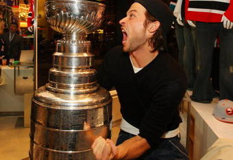 NEW YORK - APRIL 15: Bas Rol of Amsterdam poses for a photo with the Stanley Cup during the NHL Playoff Kickoff Party on April 15, 2009 at NHL Powered by Reebok Store in Manhattan. New York  (Photo by Mike Stobe/Getty Images for the NHL)