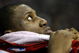 AUBURN HILLS, MI - APRIL 29:  Thaddeus Young #21 of the Philadelphia 76ers looks on from the bench while playing the Detroit Pistons in Game Five of the Eastern Conference Quarterfinals during the 2008 NBA Playoffs at the Palace of Auburn Hills on April 29, 2008 in Auburn Hills, Michigan. Detroit won the game 98-61 to take a 3-2 series lead. NOTE TO USER: User expressly acknowledges and agrees that, by downloading and or using this photograph, User is consenting to the terms and conditions of the Getty Images License Agreement.  (Photo by Gregory Shamus/Getty Images)