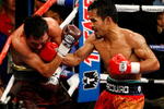 LAS VEGAS - DECEMBER 06:  (R-L) Manny Pacquiao of the Philippines connects with a right to the head of Oscar De La Hoya during their welterweight fight at the MGM Grand Garden Arena December 6, 2008 in Las Vegas, Nevada.  (Photo by Ethan Miller/Getty Images)