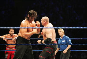 SYDNEY, AUSTRALIA - JUNE 15:  The Great Khali (2nd-L) faces of against ECW Champion Kane during WWE Smackdown at Acer Arena on June 15, 2008 in Sydney, Australia.  (Photo by Gaye Gerard/Getty Images)