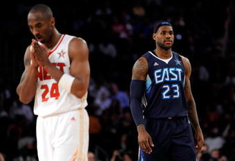 PHOENIX - FEBRUARY 15:  Kobe Bryant #24 of the Western Conference walks across the court in front of LeBron James #23 of the Eastern Conference during the 58th NBA All-Star Game, part of 2009 NBA All-Star Weekend at US Airways Center on February 15, 2009 in Phoenix, Arizona.  NOTE TO USER: User expressly acknowledges and agrees that, by downloading and or using this photograph, User is consenting to the terms and conditions of the Getty Images License Agreement.  (Photo by Kevork Djansezian/Getty Images)
