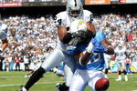 SAN DIEGO - OCTOBER 14:  Tight end Antonio Gates #85 of the San Diego Chargers has his pass broken up by Safety Michael Huff #24 of the Oakland Raiders on October 14, 2007 at Qualcomm Stadium in San Diego, California.  (Photo by Donald Miralle/Getty Images)