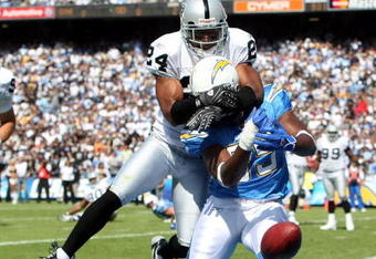 SAN DIEGO - OCTOBER 14:  Tight end Antonio Gates #85 of the San Diego Chargers has his pass broken up by Safety Michael Huff #24 of the Oakland Raiders on October 14, 2007 at Qualcomm Stadium in San Diego, California.  (Photo by Donald Miralle/Getty Images)