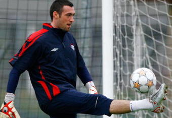 GLASGOW, UNITED KINGDOM - OCTOBER 22:  Allan McGrtegor of Rangers stretches for a ball during a team training session at Murray Park ahead of their Champions League, Group E match against Barcelona October 22, in Glasgow, Scotland.  (Photo by Jeff J Mitchell/Getty Images)